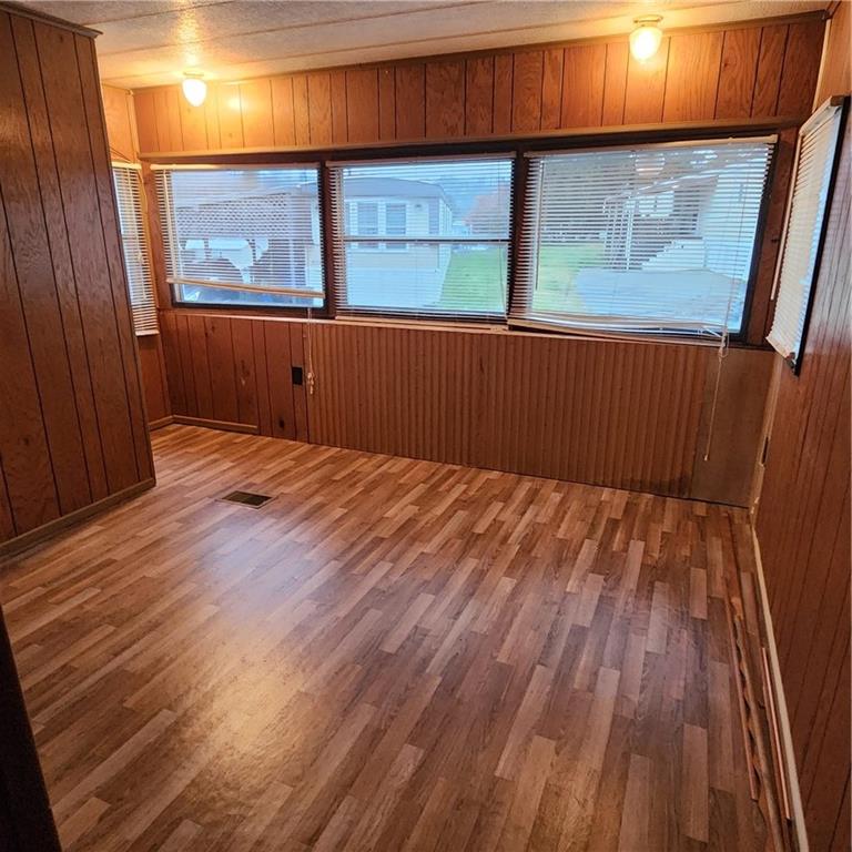 502 Bower Avenue Washington, PA 15301 - Photo 6 of 13 a view of empty room with wooden floor and fan