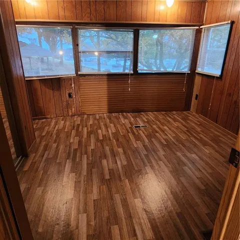 a view of a balcony with wooden floor