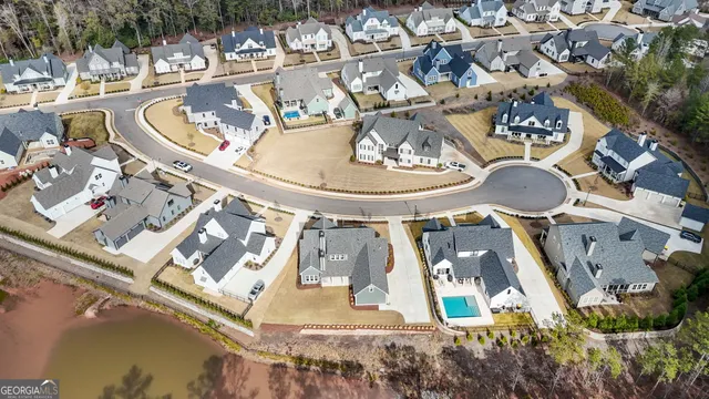 a view of a house with wooden fence
