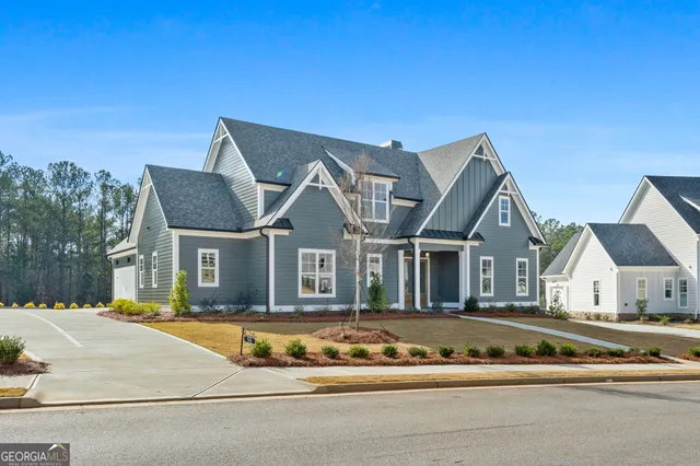 a view of an empty room with a fireplace and floor to ceiling window