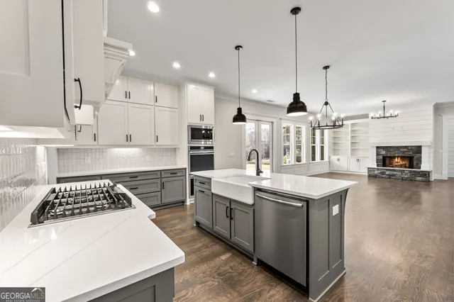 a bathroom with a toilet sink vanity and mirror