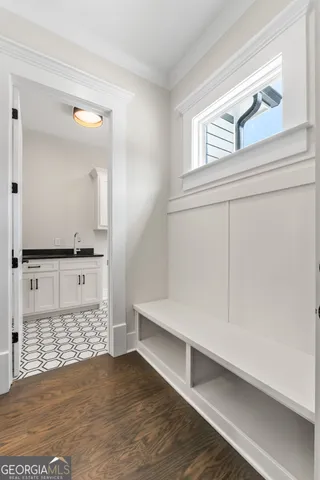 a spacious bathroom with double vanity and mirrors
