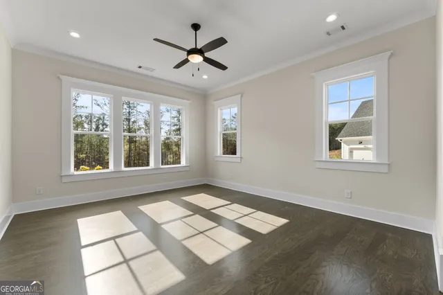 a bathroom with a double vanity sink a toilet and shower