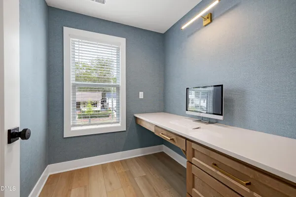 a room with pool table and window
