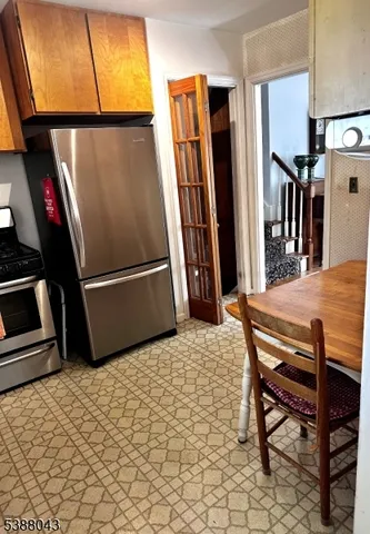a dining room with furniture and a window