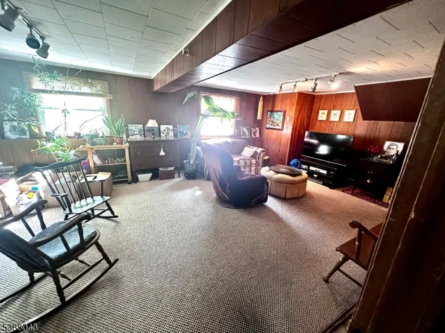 a lobby with furniture and rug