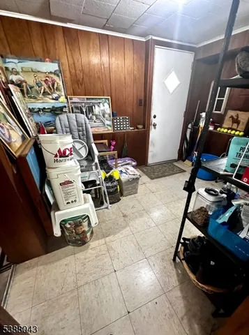 a room with lots of furniture and a flat screen tv