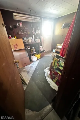 a room with pool table and window