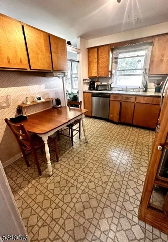 a living room with hard wood floors and a ceiling fan