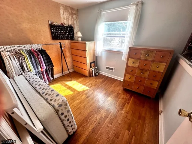 a living room with lots of furniture and book shelf