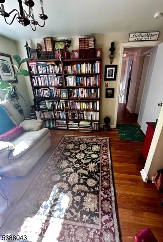 a lobby with furniture and a flat screen tv
