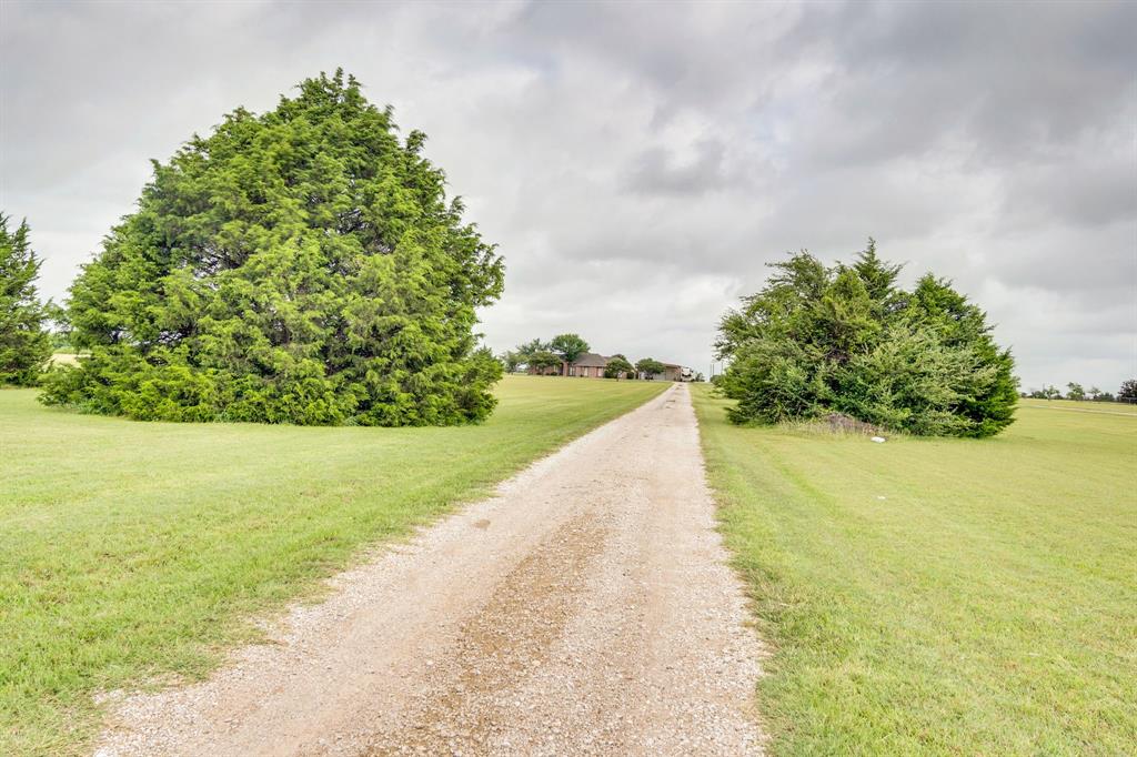431 Mc Alpin Road Midlothian, TX 76065 - Photo 13 of 18 Gravel driveway with expansive green lawn and mature trees