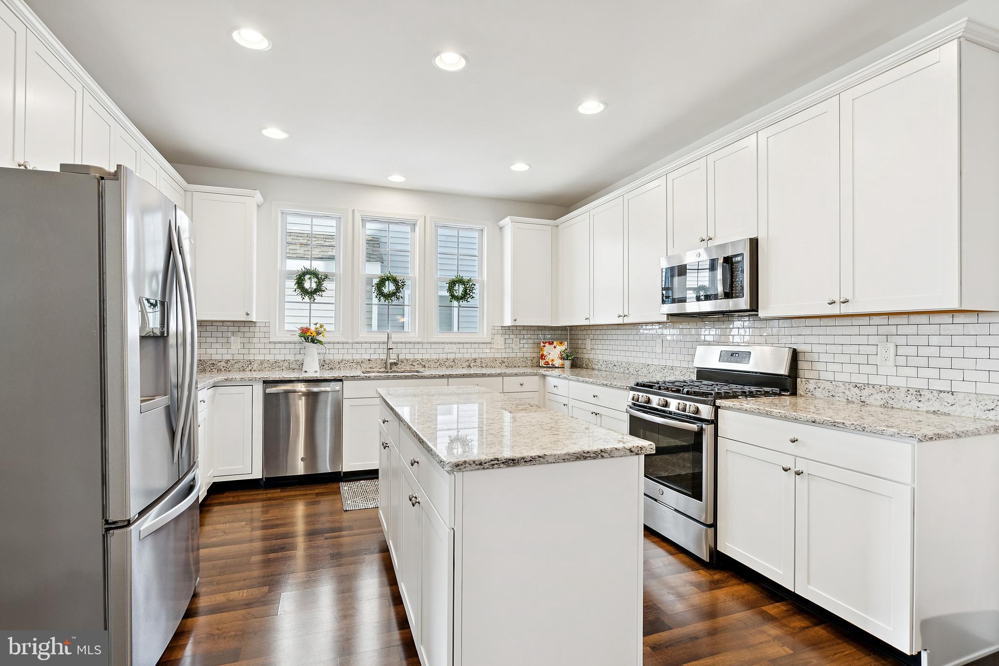 3 Antron Brown Way Chesterfield, NJ 08515 - Photo 11 of 28 a kitchen with white cabinets and stainless steel appliances