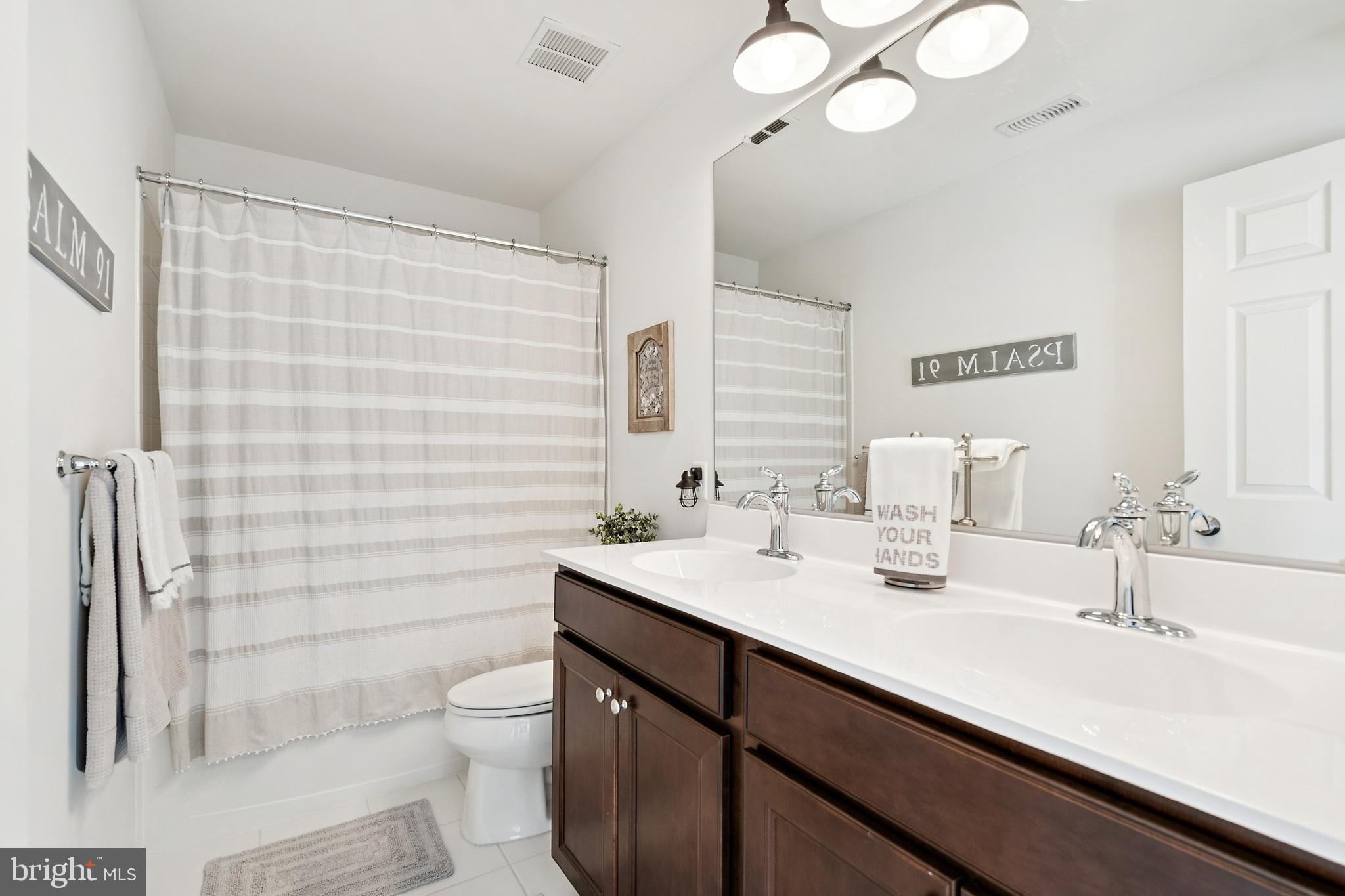 3 Antron Brown Way Chesterfield, NJ 08515 - Photo 21 of 28 a bathroom with a double vanity sink toilet and a mirror