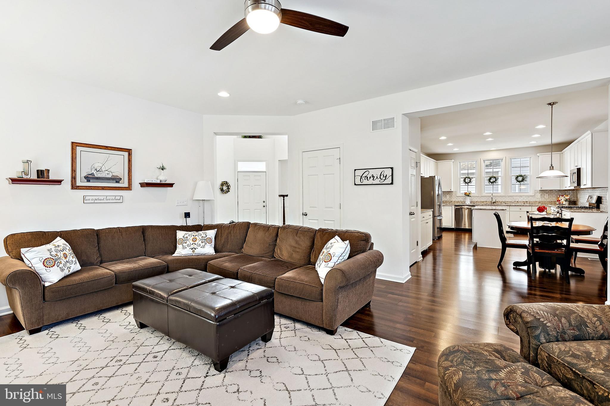 3 Antron Brown Way Chesterfield, NJ 08515 - Photo 7 of 28 a living room with furniture kitchen view and a wooden floor