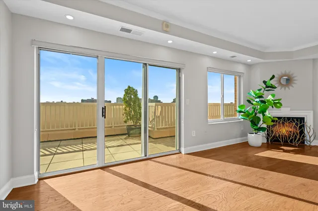 a living room with a garden and a potted plant