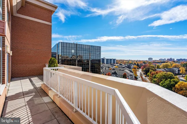 a view of a brick house with many windows