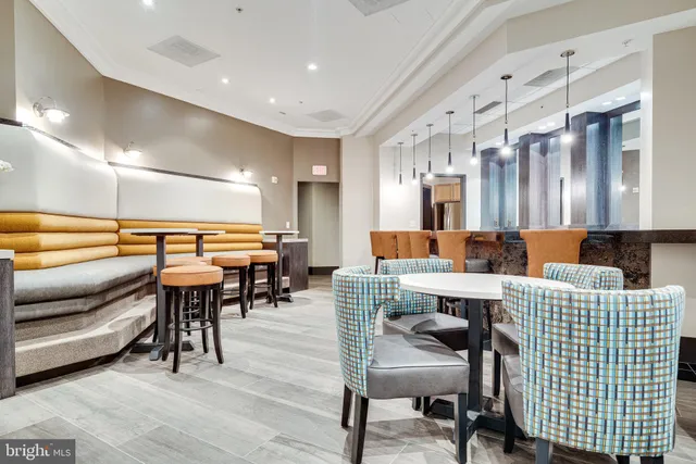 a large kitchen with stainless steel appliances lots of counter space and a sink