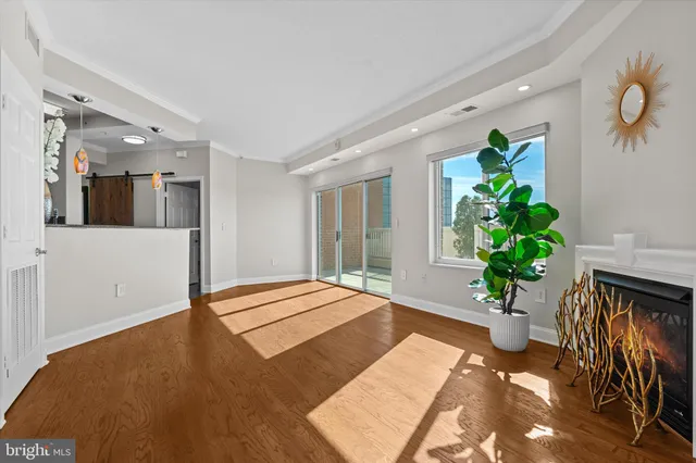 a bedroom with a bed and a potted plant