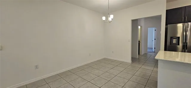 an empty room with wooden floor