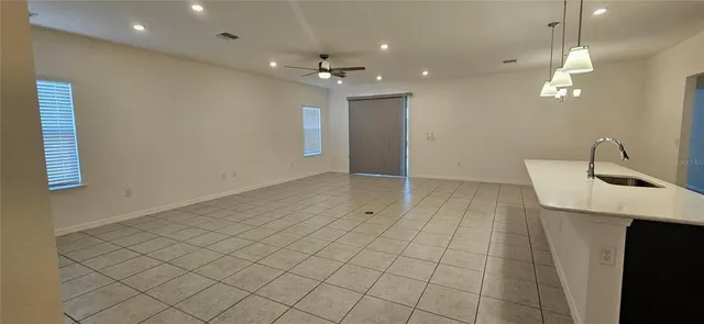 a view of an empty room and window