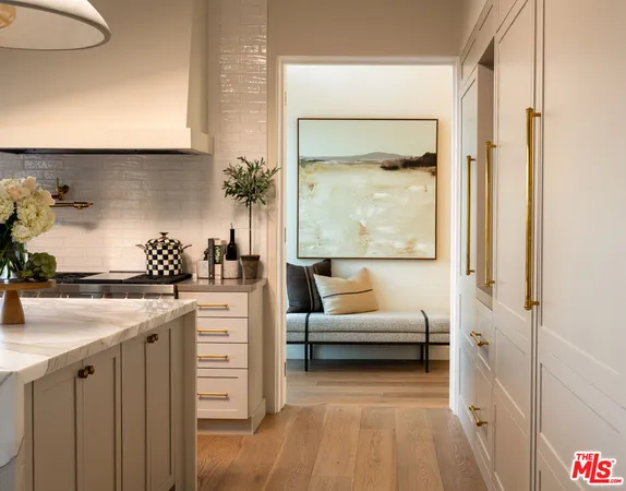 a en suite bathroom with a granite countertop sink and a mirror