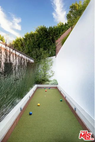 a view of a swimming pool with a yard