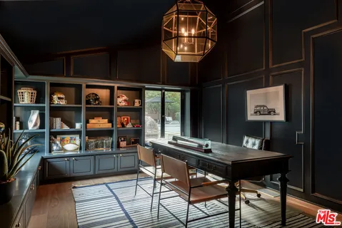 a view of a workspace with furniture