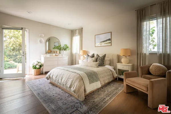 a bedroom with bed and a window