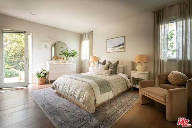 a bedroom with bed and a window