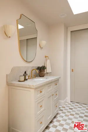 a bathroom with a sink and a mirror