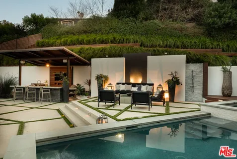 a view of a swimming pool with a patio