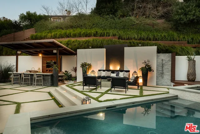 a view of a swimming pool with a patio