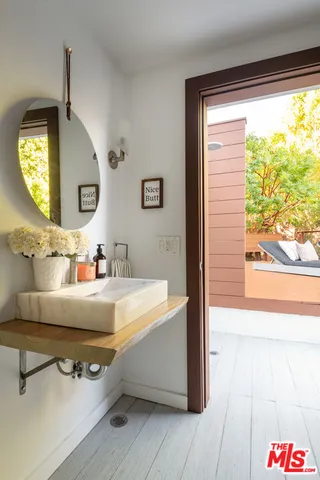 a bathroom with a sink and a mirror
