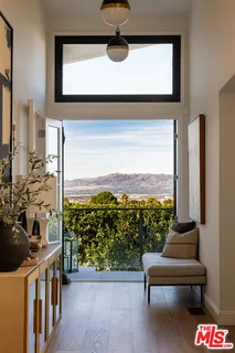 a view of a balcony with chairs