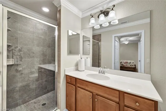 a bathroom with a double vanity sink mirror and shower
