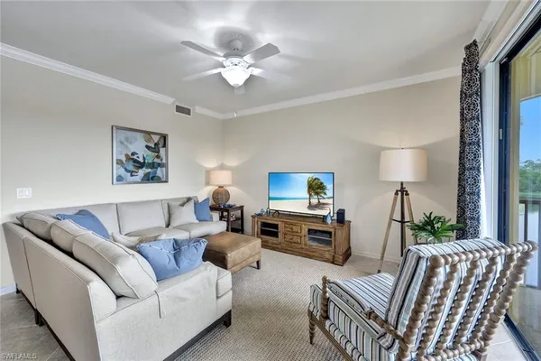 a living room with furniture fireplace and a flat screen tv