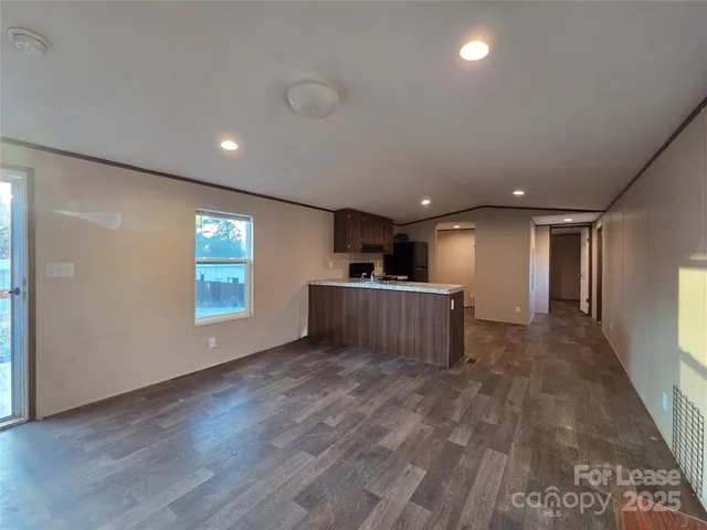 a view of a kitchen with a sink and a window