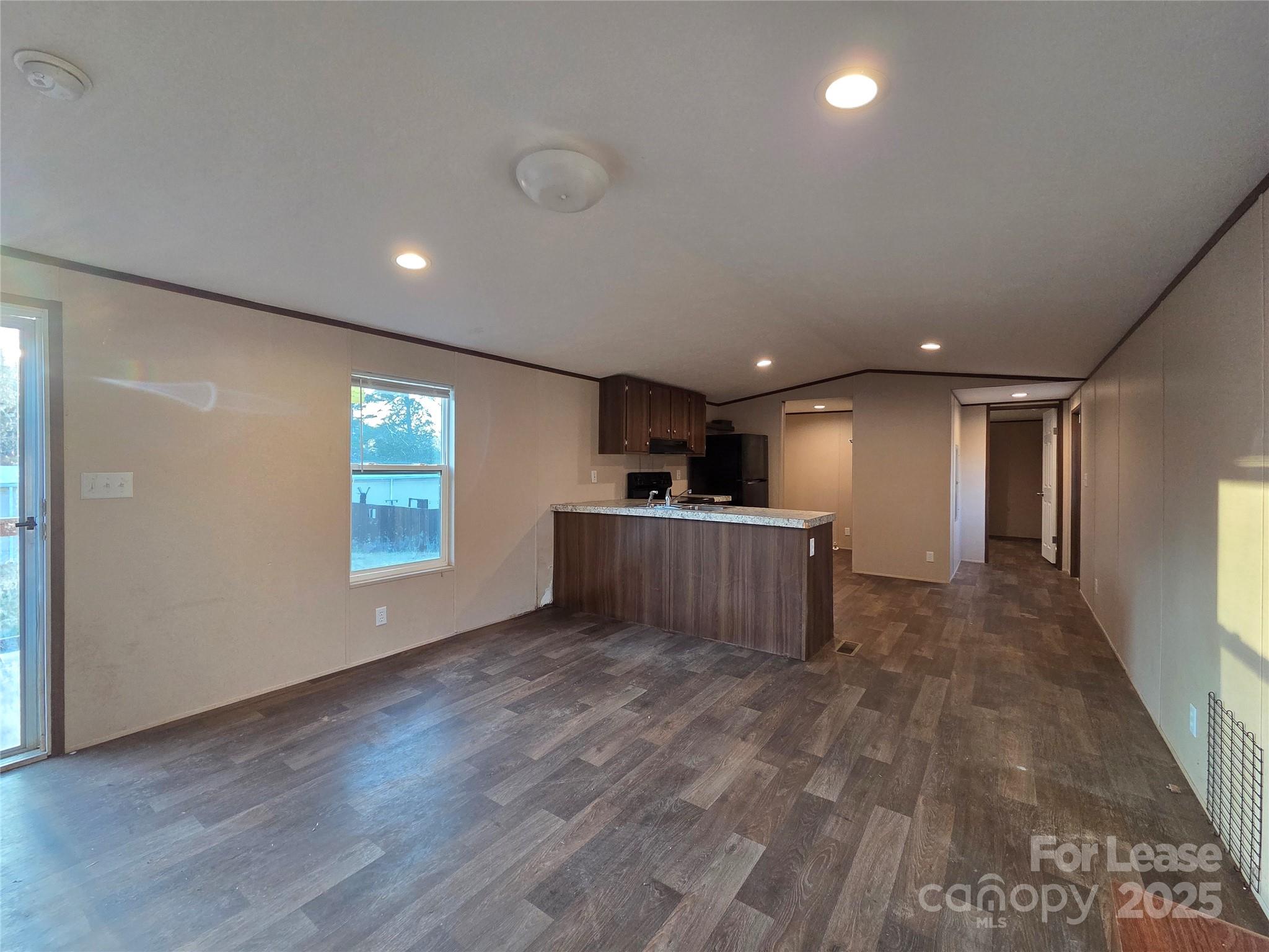 2329 Rufus Ratchford Road Gastonia, NC 28056 - Photo 4 of 10 a view of a kitchen with a sink and a window