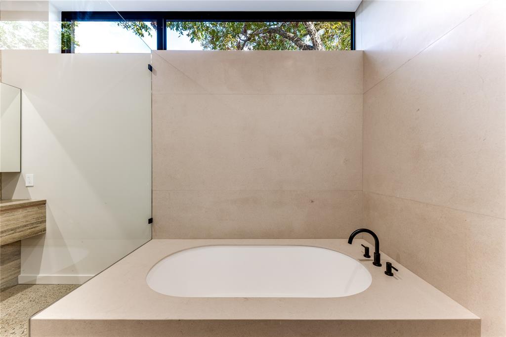 6145 Llano Avenue Dallas, TX 75214 - Photo 18 of 40 a bathroom with a tub