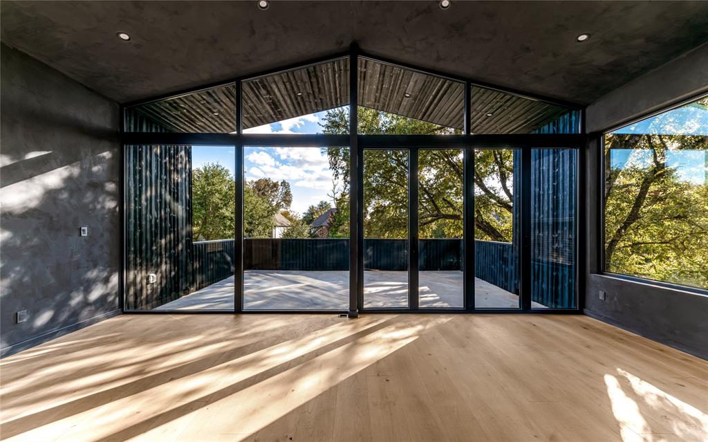 6145 Llano Avenue Dallas, TX 75214 - Photo 22 of 40 a view of an empty room with a balcony
