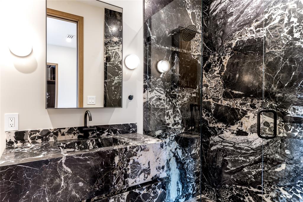 6145 Llano Avenue Dallas, TX 75214 - Photo 25 of 40 a bathroom with a sink and a mirror