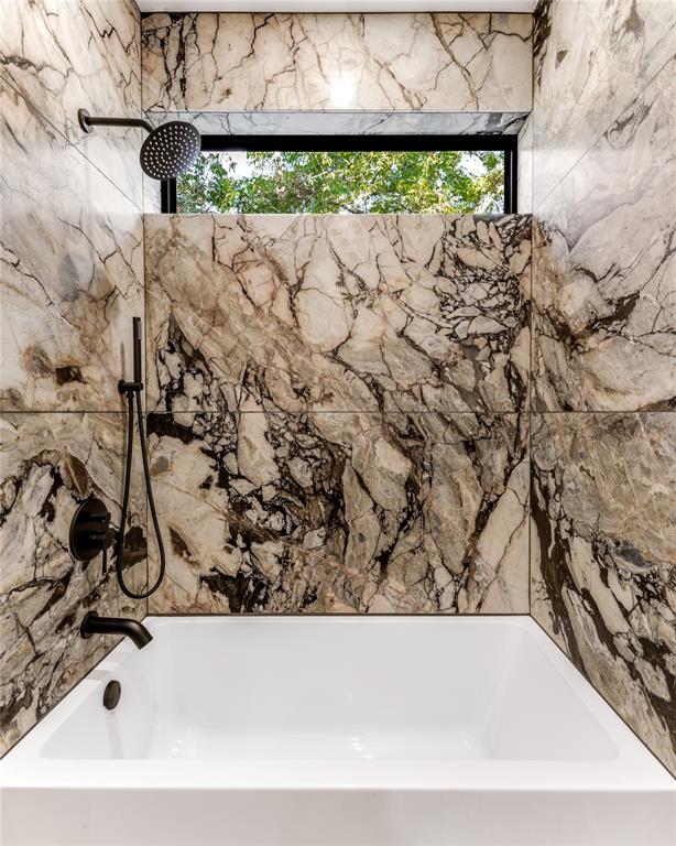 6145 Llano Avenue Dallas, TX 75214 - Photo 28 of 40 a white bath tub sitting in a bathroom