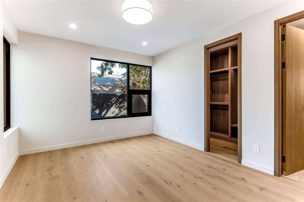 6145 Llano Avenue Dallas, TX 75214 - Photo 29 of 40 an empty room with wooden floor and window