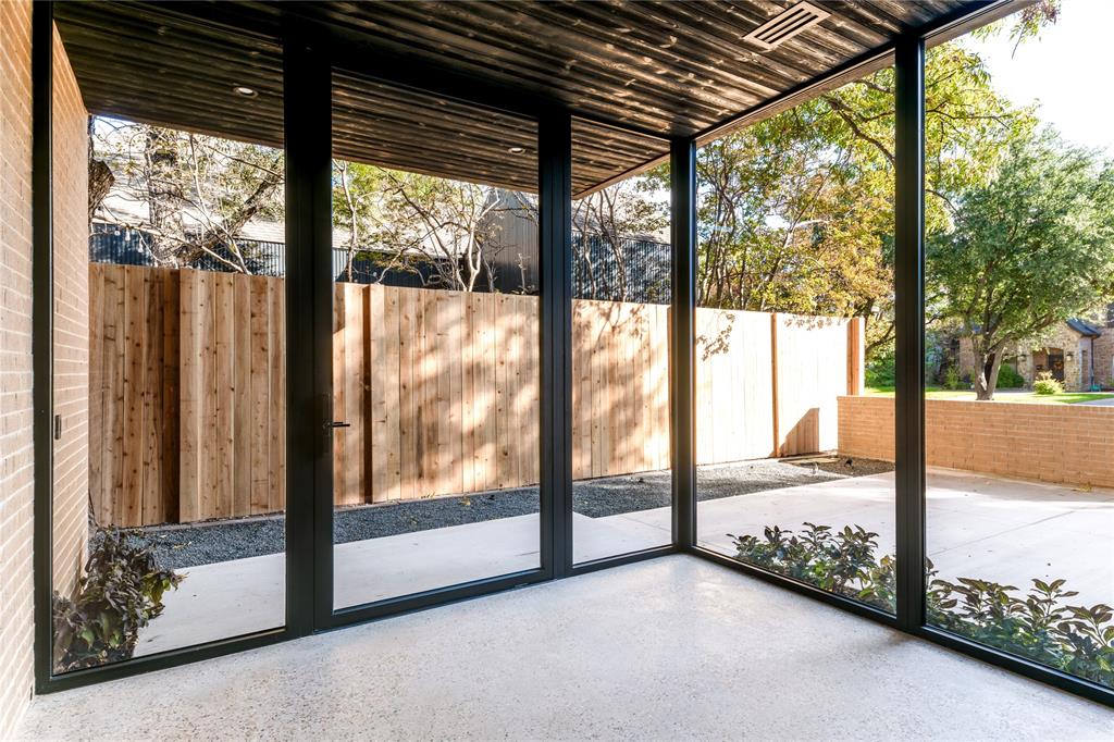 6145 Llano Avenue Dallas, TX 75214 - Photo 3 of 40 a view of an empty room with a large window