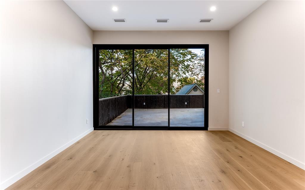 6145 Llano Avenue Dallas, TX 75214 - Photo 37 of 40 an empty room with wooden floor and windows