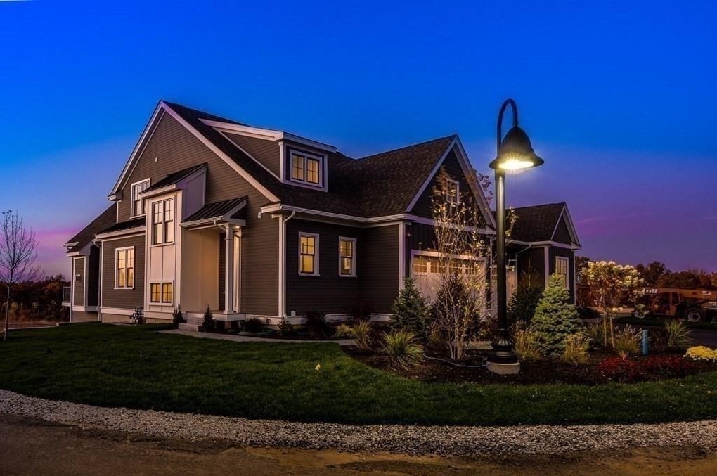 30 Waterville Lane, Unit 30 Hopkinton, MA 01748 - Photo 18 of 22 a front view of a house with a yard