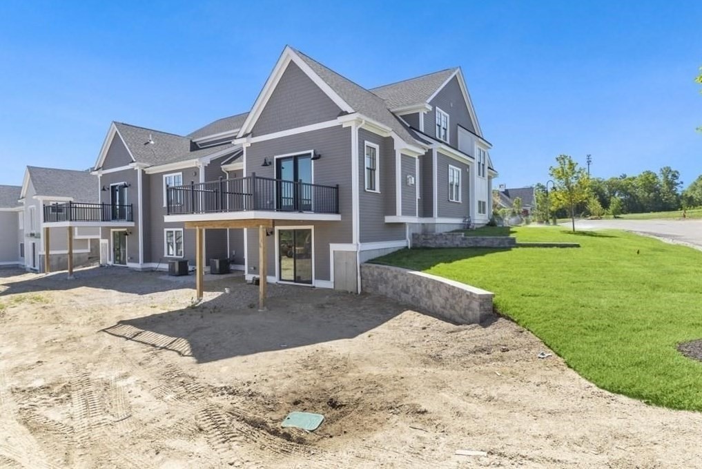 30 Waterville Lane, Unit 30 Hopkinton, MA 01748 - Photo 21 of 22 a front view of a house with a yard