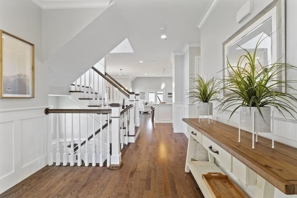 30 Waterville Lane, Unit 30 Hopkinton, MA 01748 - Photo 7 of 22 a view of staircase and kitchen with wooden floor