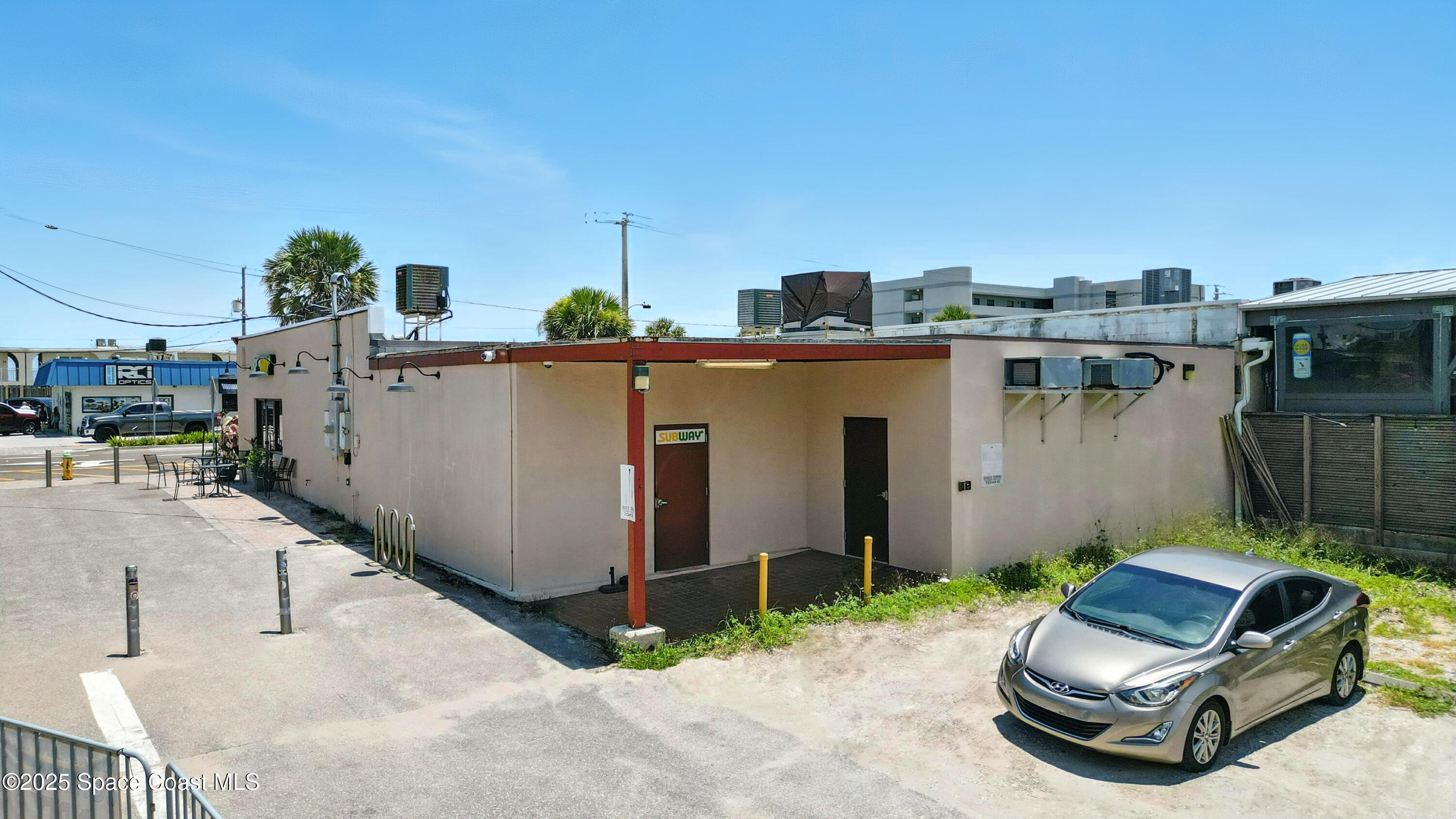 26 South Atlantic Avenue Cocoa Beach, FL 32931 - Photo 41 of 62 a view of a patio with a table and chairs